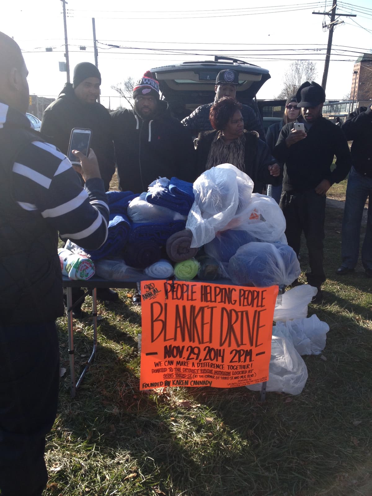 People Helping People Blanket Drive — November 2014, team with supplies and sign