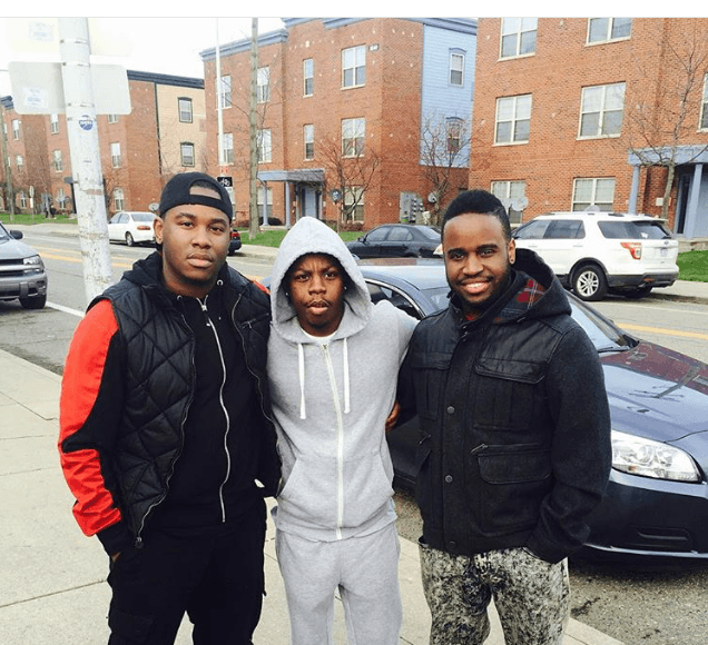 Three young supporters of Generous Giving on a Detroit street