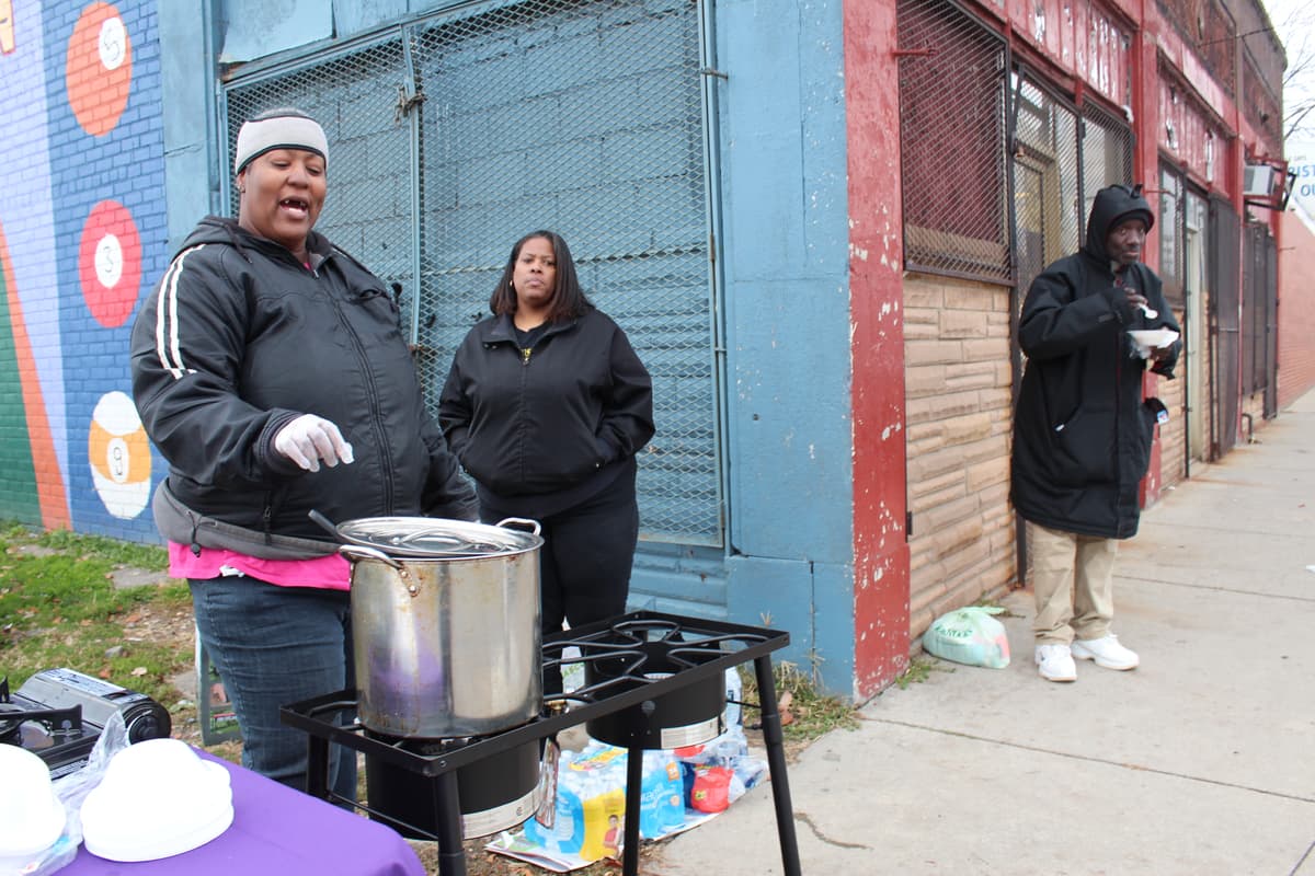 Karen serving hot soup to the community on a cold Detroit day